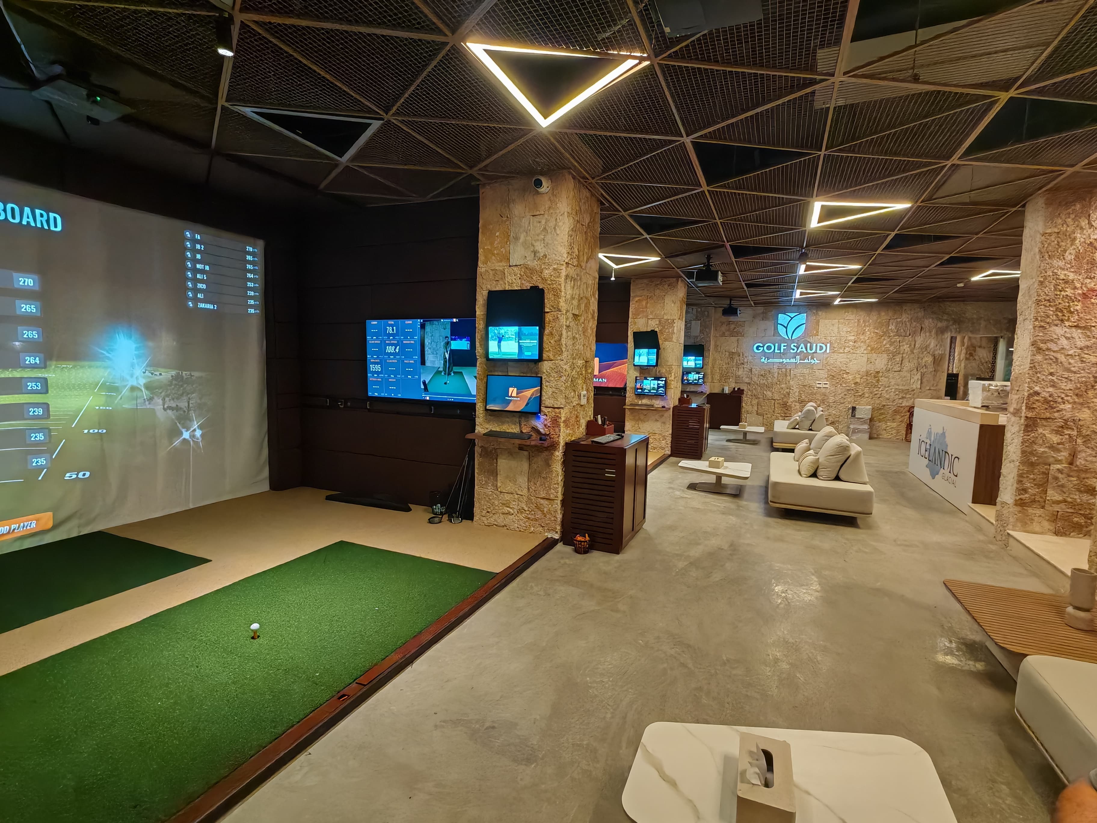 Indoor golf academy lounge and simulator bays delivered by Marafei Golf