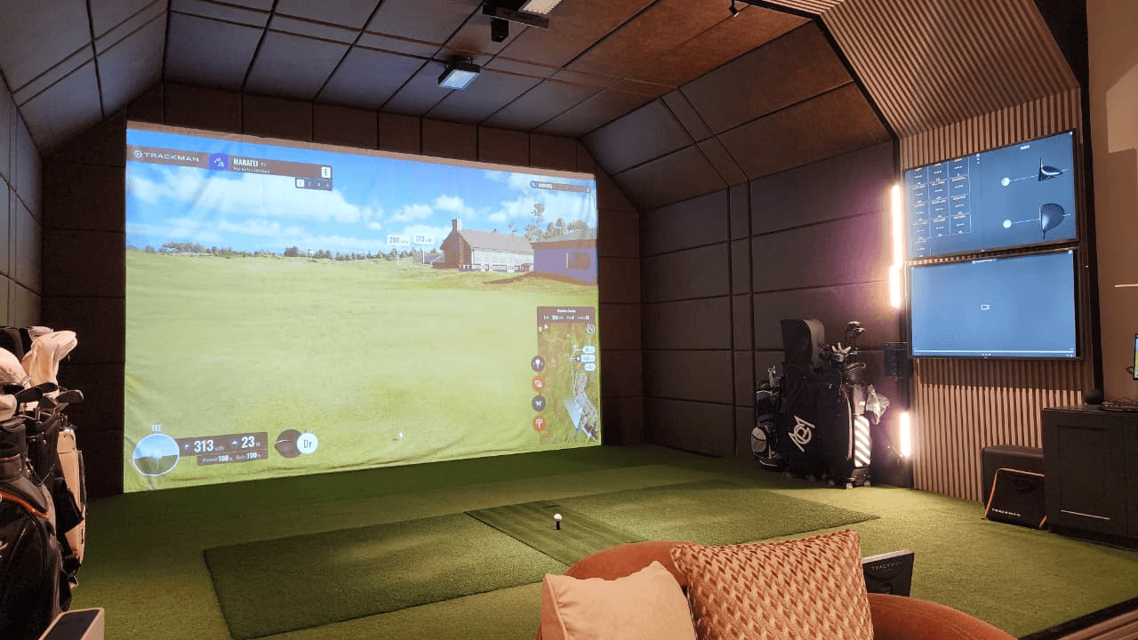 Indoor golf simulator bay for resort guests at Massarah Resort, Saudi Arabia